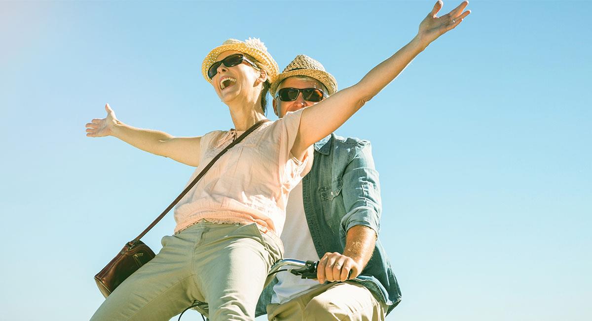 Sage Hervey Bay couple riding bike happily